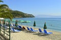 Ipsos Beach in Corfu sun loungers Royalty Free Stock Photo