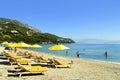 Ipsos Beach in Corfu sun loungers Royalty Free Stock Photo