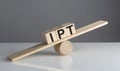 IPT - Item Per Transaction on wooden cubes on a wooden balance , business concept Royalty Free Stock Photo