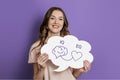 iq eq concept. girl holding poster with hand drawing a brain and heart Royalty Free Stock Photo