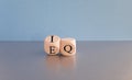 IQ or EQ symbol. Psychologist flips a cube, changes words IQ, intelligence quotient to EQ, emotional quotient. Royalty Free Stock Photo