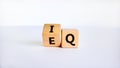 IQ or EQ symbol. Turned a cube, changed words IQ, intelligence quotient to EQ, emotional quotient. Beautiful white background. Royalty Free Stock Photo