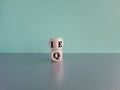 IQ or EQ symbol. Turned cube, changes words IQ, intelligence quotient to EQ Royalty Free Stock Photo