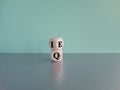 \'IQ\' or EQ. Wooden cubes with the expression