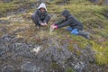 Two Inuit Berry Picking on the Tundra