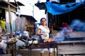 Image of woman cook. Street food in open market in Peruvian jungle city.