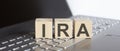 IRA abbreviation stands for written on a wooden cube on laptop