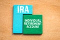 IRA. INDIVIDUAL RETIREMENT ACCOUNT concept. Colored wooden blocks, puzzle and mind game Royalty Free Stock Photo