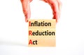 IRA inflation reduction act symbol. Concept words IRA inflation reduction act on wooden blocks on a beautiful white table white