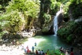Sari, Iran - 18 July 2017: Waterfall at north of Iran, with iranian taking a swim with clothes and preparing barbacoe and iranian Royalty Free Stock Photo