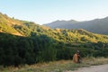 Mazandaran, Iran - 19 July 2017: Iranian man sitting in the side of the road in the mountains. Shepherd resting