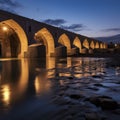iran ancient bridge over river at blue hour night
