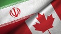 Iran and Canada two flags textile cloth, fabric texture
