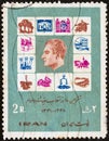 IRAN - CIRCA 1970: A stamp printed in Iran shows symbols of reform laws and Shah Mohammad Reza Pahlavi, circa 1970.