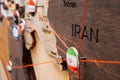 Iran flag on the pin with red thread showed the paths on the wooden map.