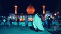 Iran, Shiraz, Mausoleum Shah Cheragh - September 17, 2016: Locals wearing traditional Muslim clothes and tourists in the mausoleum