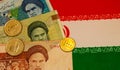 Iranian currency banknotes and the national flag as the background