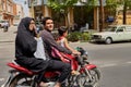 Iranian family rides a motorcycle on busy street, Kashan, Iran. Royalty Free Stock Photo