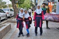 Iranian girls in school uniform on a city street.