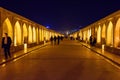 Iranian people walk on Allahverdi Khan Bridge called Siosepol at night. Isfahan. Iran