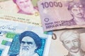 Iranian Rial and Indonesian money Rupiah banknotes.