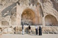 Iranian tourists watching the famouse Arches of Taq-e Bostan