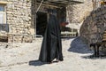 Iranian woman on a street in rock cones in Kandovan village. East Azerbaijan province. Iran Royalty Free Stock Photo