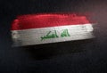 Iraq Flag Made of Metallic Brush Paint on Grunge Dark Wall Royalty Free Stock Photo