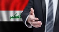 Iraqi business, politics, cooperation and travel concept. Hand on flag of Iraq background