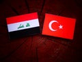 Iraqi flag with Turkish flag on a tree stump Royalty Free Stock Photo