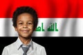 Iraqi kid boy on flag of Iraq background. Education and childhood concept Royalty Free Stock Photo