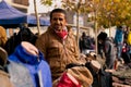 Iraqi MAN SMILING ON STREET SELLING CLOTHES Royalty Free Stock Photo