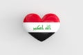 Iraqi souvenir - a heart-shaped badge with the flag of Iraq as a symbol of patriotism and pride in their country. State Royalty Free Stock Photo