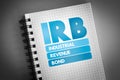 IRB - Industrial Revenue Bond acronym on notepad, business concept background