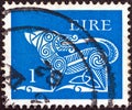 IRELAND - CIRCA 1971: A stamp printed in Ireland shows a dog from an ancient artwork, circa 1971. Royalty Free Stock Photo
