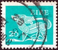 IRELAND - CIRCA 1971: A stamp printed in Ireland shows a dog from an ancient artwork, circa 1971. Royalty Free Stock Photo