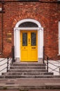 Ireland. Cork. Architecture. Details. A typical main entrance. Yellow door