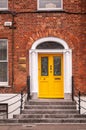 Ireland. Cork. Architecture. Details. A typical main entrance. Yellow door