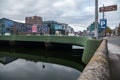 Ireland. Cork. The River Lee. The Christy Ring Bridge with the sides designed by the coating of green steel bars