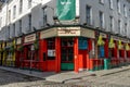 Dublin, a shot of a red temple bar Fitzsimons in the corner of the street Royalty Free Stock Photo