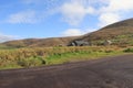 Exploring Ireland Countryside - greenary, blue sky, small houses - Irish countryside tours