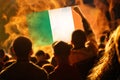 Ireland protest. Protests Dublin. People rise hand. Ireland flag. Street riot. Demonstration. Fire and flame. Destroy