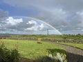 Ireland rainbow in blue skys to a pot of gold