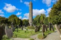 Tower and tombstones at Glendalough. Royalty Free Stock Photo