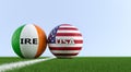 Ireland vs. USA Soccer Match - Soccer balls in Ireland and Costa Rica national colors on a soccer field. Royalty Free Stock Photo