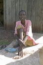 Irene, infected with HIV/AIDS, sits on ground at the Pepo La Tumaini Jangwani, HIV/AIDS Community Rehabilitation Program