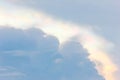 Iridescent cloud in blue sky.