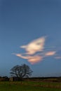 An iridescent Polar Stratospheric Nacreous Cloud formation over Farm Fields near to Arbroath Royalty Free Stock Photo