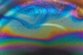 Iridescent soap bubble surface creating abstract fluid background Royalty Free Stock Photo