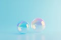 Iridescent soap bubbles on pastel blue background